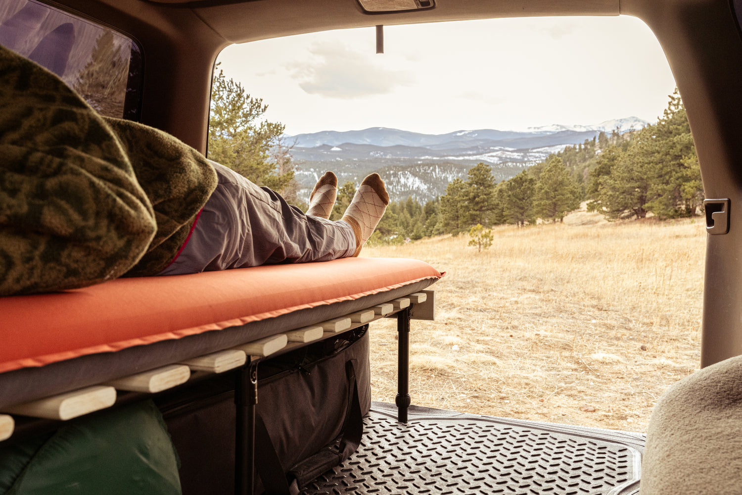 Hele Box car camping platform with someone sleeping on it