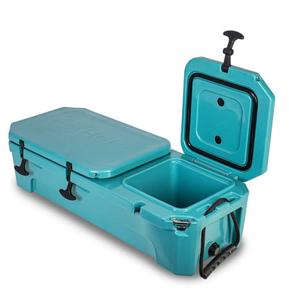 A teal cooler with its lid open, showing the interior storage compartment and black latches, handles, and hose attachment point, photographed on a clean white background.