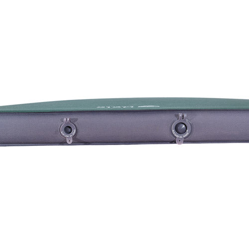 Close-up of the side of an inflatable sleeping pad, showing a dark gray body with two valve ports and a green top layer, on a white background.