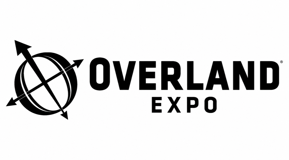 Black Overland Expo logo on a white background, featuring a circular globe with arrows and the words 'OVERLAND EXPO'.
