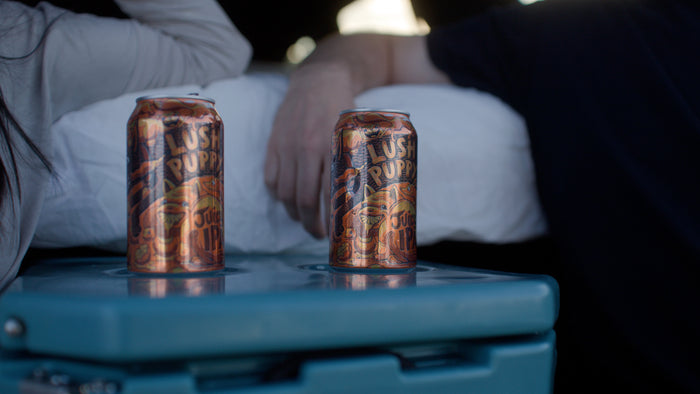 cupholders being put to use on car camping cooler